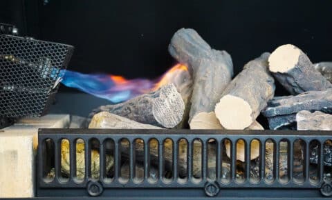 Built-in gas lighter to light a wood fire