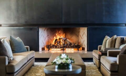 Wood fireplace with herringbone bricks