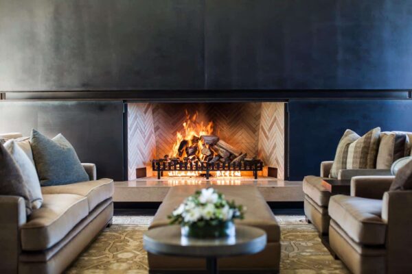 Wood fireplace with herringbone bricks