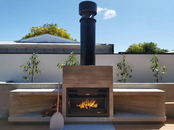 Built-in outdoor fireplace with BBQ and pizza oven with big flue